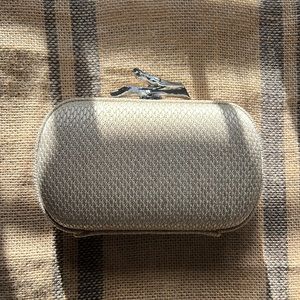 Diane Von Furstenberg clutch in creamy gold tone with a silver chain